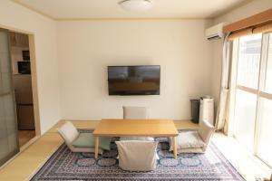 TV a/nebo společenská místnost v ubytování Guesthouse Life Field