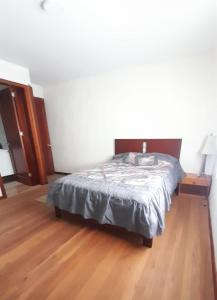 Ένα ή περισσότερα κρεβάτια σε δωμάτιο στο Colinas de Ricaurte Lodge