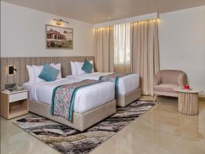 Postel nebo postele na pokoji v ubytování Regenta Anantam Resort Khatu Shyam Ji at 52 bigha parking khatu shyam ji