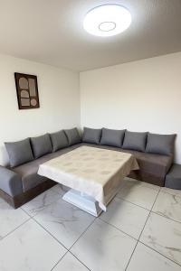 a living room with a couch and a table at Appartement t3 à Montpellier in Montpellier