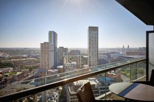 a view of a city skyline from a building at Meriton Suites Campbell Street, Sydney in Sydney