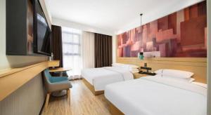 TV a/nebo společenská místnost v ubytování City Comfort Inn Wuhan Yuanlin Road Metro Station