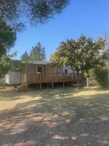 a house with a porch and a deck at BT - Le Soleia, confort & lumière, 2 ch, 2 sdb, entre mer et Petite Camargue, super équipé in Lattes
