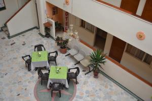 an overhead view of a room with tables and chairs at Hotel Dorado Real in Fusagasuga