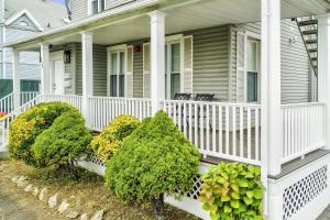 a white house with bushes on the front porch at Harbor Haven, Apt #1 - Studio in Stamford +40 photos