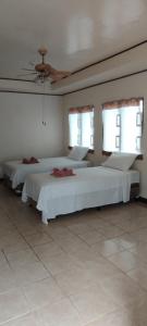 Voodi või voodid majutusasutuse Nova Beach Resort toas