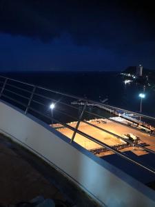 a view of the deck of a cruise ship at night at Bangsaen sansuk in Ban Laem Thaen
