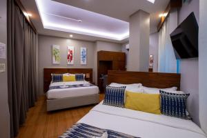 Postel nebo postele na pokoji v ubytování Alima ARQ Beach Resort + 55 fotografií