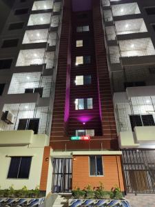 a view of an apartment building at night at Best Eastern Apartment in Dhaka