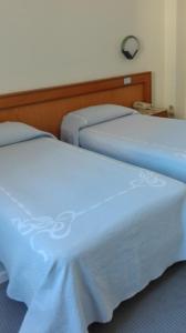 Postel nebo postele na pokoji v ubytování Hotel Excelsior
