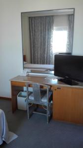 TV a/nebo společenská místnost v ubytování Hotel Excelsior