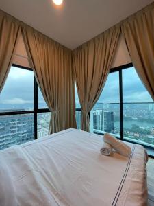 Postel nebo postele na pokoji v ubytování Reizz Residence By Sweet Home