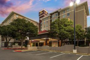 a rendering of a hotel with a parking lot at La Quinta by Wyndham San Antonio Airport in San Antonio