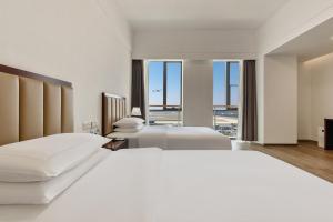 Postel nebo postele na pokoji v ubytování 北京明珠酒店Beijing CSN Pearl Hotel + 44 fotografií