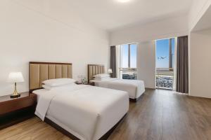 Postel nebo postele na pokoji v ubytování 北京明珠酒店Beijing CSN Pearl Hotel