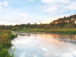 a river with a reflection of the sky in the water at 6 person holiday home in Ans By in Roe