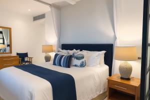 Ένα ή περισσότερα κρεβάτια σε δωμάτιο στο Fairview Signature Suites +24 φωτογραφίες