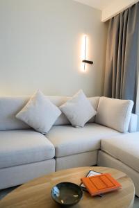 a living room with a couch and a table at Nexa Suite in Komotini