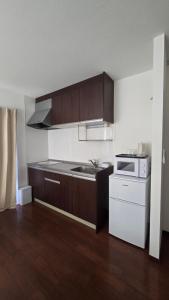 Кухня или мини-кухня в メゾンドオーク 新大久保
