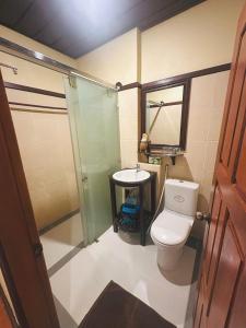 a bathroom with a toilet and a sink and a shower at Luang Prabang Champa Villa Hotel in Luang Prabang +41 photos