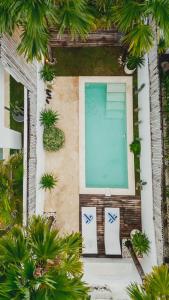 an overhead view of a swimming pool in a resort at Soho Loft in Uluwatu