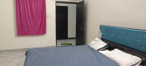 Postel nebo postele na pokoji v ubytování HOTEL O RAMESHWARAM AND BANQUET HALL