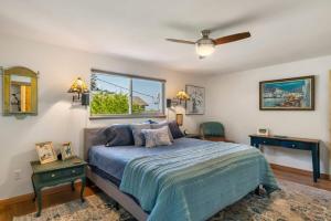 a bedroom with a bed and a ceiling fan at 3 Bed Gorgeous Views Hot Tub Dog Friendly Ada in Langley