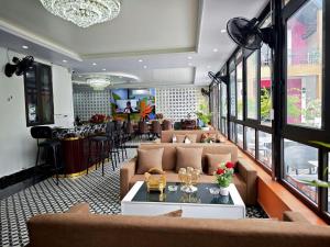 a lobby with couches and a bar in a building at Hana Homestay KGR in Xuan Dam