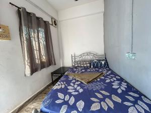 Giường trong phòng chung tại Patrem's Guest House