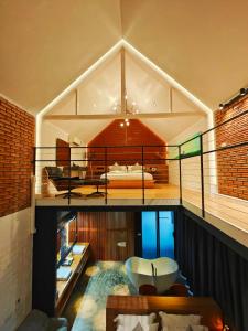 a room with a bed and a tub on a balcony at M5 Hotel in Chiang Mai