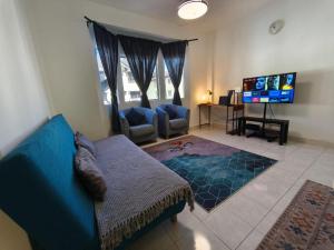 TV a/nebo společenská místnost v ubytování Puncak Cameron Holiday