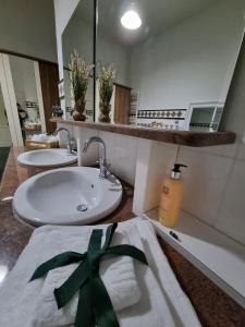a bathroom with a sink and a towel on a counter at Central House Craiova in Craiova