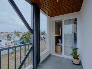 a balcony with a view of a city at Nine, Boutique hotel with luxury room stay, mysore in Mysore