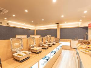 a buffet line in a restaurant with food on display at MAX CUBE Inami Seafront in Inami