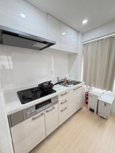 Η κουζίνα ή μικρή κουζίνα στο TOMI Hotel 神保町301 +21 φωτογραφίες