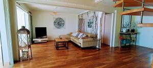 Posezení v ubytování LA PALMERAIE - Locations de Villas et Appartements