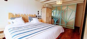 Postel nebo postele na pokoji v ubytování LA PALMERAIE - Locations de Villas et Appartements + 74 fotografií