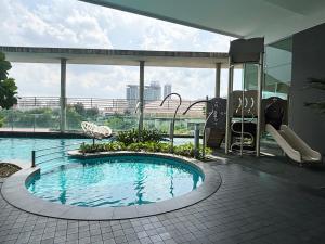 a swimming pool in the middle of a building at Casa Residency Bukit Bintang by PILLOWTALKS in Kuala Lumpur +16 photos