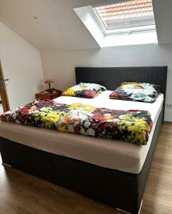 two beds in a room with a bedskirts at Ferienwohnung Wendel in Sankt Wendel