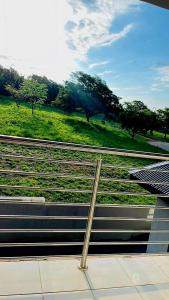 a train station with a view of a green field at The Perazim Place in Hazyview