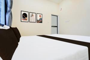 Ένα ή περισσότερα κρεβάτια σε δωμάτιο στο PK Hotel lodging & Restaurant