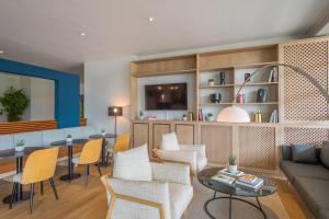 TV a/nebo společenská místnost v ubytování Hotel Münster Kongresscenter affiliated by Meliá