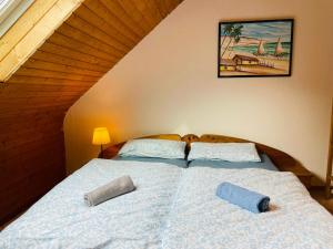 a bedroom with a bed with two pillows on it at Odw homes - Functional workers apartment in Weinheim