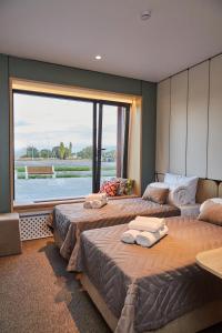 Ένα ή περισσότερα κρεβάτια σε δωμάτιο στο Keruen inn Aral