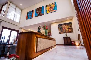 a large living room with a large flat screen tv at Gilded Palms Villa, Ubud Payangan, Bali in Payangan +72 photos