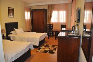 Uma cama ou camas num quarto em Best View Pyramids Hotel