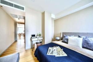 En eller flere senge i et værelse på PROMO Luxury 2BR SuitePrime Spot + 39 billeder