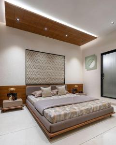 a large bedroom with a large bed in a room at Star Holiday in Virār