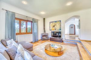 a living room with a couch and a table at Can Busca - Ideal Property Mallorca in Costitx