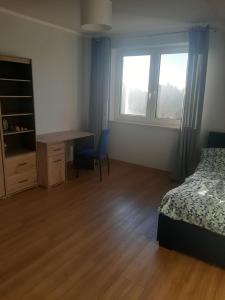 Postel nebo postele na pokoji v ubytování Dom na Beskidzkiej